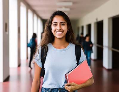 Teen smiling while walking to class